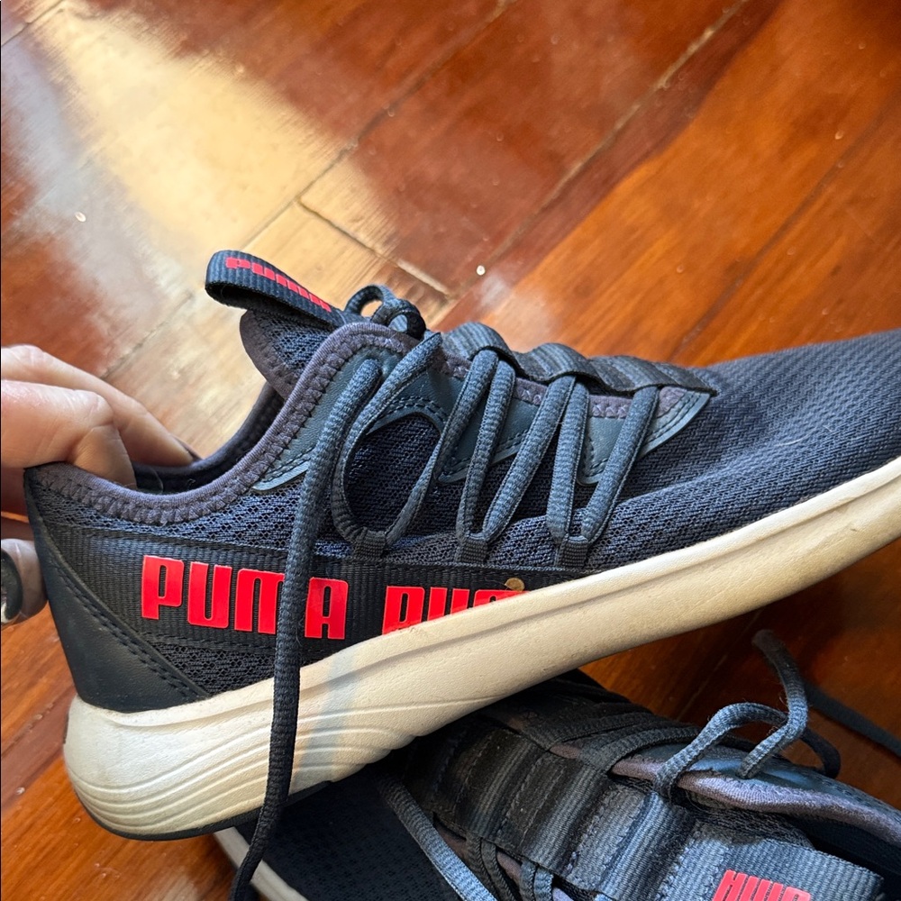 Puma women’s navy and Red Sneakers